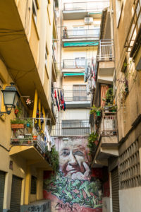 Spain, Granada, Realejo, street art by artist Raul Ruiz, portrait of a woman, back yard Spain, Granada, Realejo, street art by artist Raul Ruiz, portrait of a woman, back yard