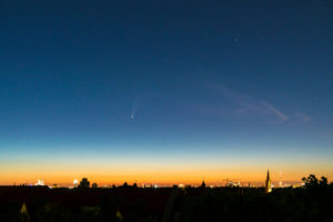 Comet "Neowise" (C / 2020 F3) over Berlin, dawn, distant view to the east, television tower Comet "Neowise" (C / 2020 F3) over Berlin, dawn, distant view to the east, television tower