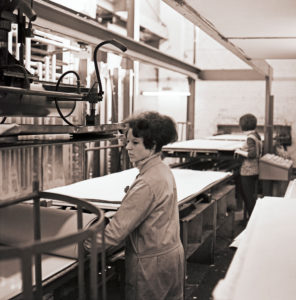 Young women at work in a cardboard box factory from the GDR period around 1968 Young women at work in a cardboard box factory from the GDR period around 1968