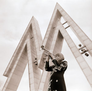 A young musician from the DFF cult series "There is music in it" is blowing the trumpet under the attractive MusterMesse symbols in front of the entrance to the Leipzig exhibition center A young musician from the DFF cult series "There is music in it" is blowing the trumpet under the attractive MusterMesse symbols in front of the entrance to the Leipzig exhibition center