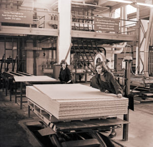 GDR era, two young women work in a particleboard plant of the Deutsche Werkstaetten Hellerau in Saxony GDR era, two young women work in a particleboard plant of the Deutsche Werkstaetten Hellerau in Saxony