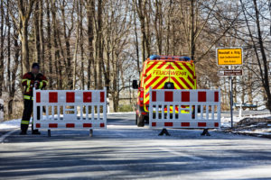 Germany, Thuringia, Ilmkreis, Großbreitenbach, Neustadt / Rnstg ,, town sign, road closure, fire engine, man Germany, Thuringia, Ilmkreis, Großbreitenbach, Neustadt / Rnstg ,, town sign, road closure, fire engine, man