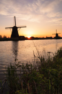Windmill at sunrise, Kinderdijk, UNESCO World Heritage Site, South Holland, Netherlands Windmill at sunrise, Kinderdijk, UNESCO World Heritage Site, South Holland, Netherlands