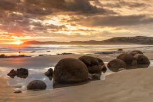 Moeraki Boulders at sunrise, Moeraki Beach, Otago, South Island, New Zealand, Oceania Moeraki Boulders at sunrise, Moeraki Beach, Otago, South Island, New Zealand, Oceania