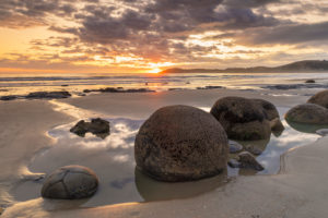 Moeraki Boulders at sunrise, Moeraki Beach, Otago, South Island, New Zealand, Oceania Moeraki Boulders at sunrise, Moeraki Beach, Otago, South Island, New Zealand, Oceania