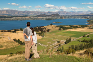 Hikers on the Roy's Peak Track enjoying the view over Lake Wanaka, Otago, South Island, New Zealand, Oceania Hikers on the Roy's Peak Track enjoying the view over Lake Wanaka, Otago, South Island, New Zealand, Oceania