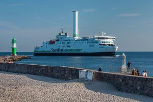 Ferry arriving at the lighthouse at the pier of Warnemünde, Mecklenburg-Vorpommern, Germany
