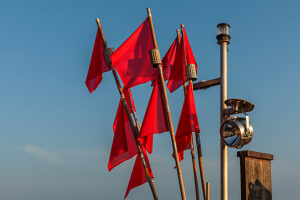 Red pennant on a fishing boat on the beach of Binz, island of Rügen, Mecklenburg-Western Pomerania, Germany