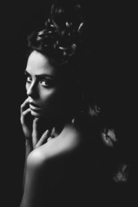 black-and-white beauty portrait, shoulder View to the camera, roses along the spine black-and-white beauty portrait, shoulder View to the camera, roses along the spine