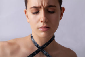 Woman with measuring tape, symbol beauty, pure skin, cosmetic surgery, be perfect Woman with measuring tape, symbol beauty, pure skin, cosmetic surgery, be perfect