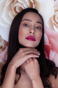 Woman, beauty, pink lips, long black hair, sensual, roses background, portrait Woman, beauty, pink lips, long black hair, sensual, roses background, portrait