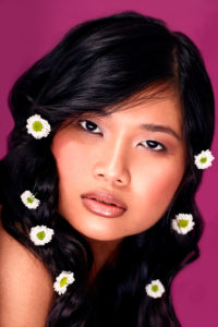 Thai girl, pink lips, long black hair, flowers, beauty, portrait Thai girl, pink lips, long black hair, flowers, beauty, portrait