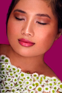 Thai girl, pink lips, flowers, relaxation, beauty, portrait Thai girl, pink lips, flowers, relaxation, beauty, portrait