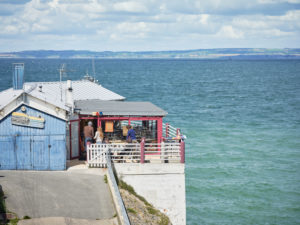 The restaurant 'Le Bigorneau Amoureux', in the first days of spring, on the steep slope next to the 'Plage des Dames' beach in Douarnenez in Brittany The restaurant 'Le Bigorneau Amoureux', in the first days of spring, on the steep slope next to the 'Plage des Dames' beach in Douarnenez in Brittany