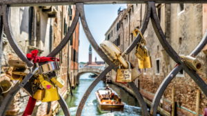 love locks in a balustrade, channel, Boat, Venice, Veneto, Italy love locks in a balustrade, channel, Boat, Venice, Veneto, Italy