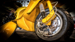 Assembling a Vespa, close up Assembling a Vespa, close up