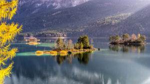 Islands in the Eibsee, Grainau, near Garmisch, Werdenfelser Land, Bavaria, Germany Islands in the Eibsee, Grainau, near Garmisch, Werdenfelser Land, Bavaria, Germany