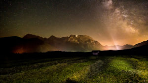 Starry sky above hump meadows, front of Karwendel, near Mittenwald, Bavaria, Germany Starry sky above hump meadows, front of Karwendel, near Mittenwald, Bavaria, Germany