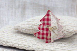 Sewed Christmas tree on cushion, still life Sewed Christmas tree on cushion, still life