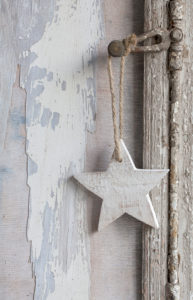 simple little Christmas star hanging on old window handle simple little Christmas star hanging on old window handle