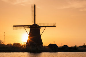 Windmill at sunrise, Kinderdijk, UNESCO World Heritage Site, South Holland, Netherlands Windmill at sunrise, Kinderdijk, UNESCO World Heritage Site, South Holland, Netherlands