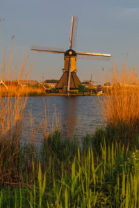 Windmill at sunrise, Kinderdijk, UNESCO World Heritage Site, South Holland, Netherlands Windmill at sunrise, Kinderdijk, UNESCO World Heritage Site, South Holland, Netherlands