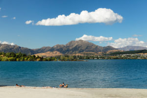 Tourists on the shores of Lake Wanaka, Otago, South Island, New Zealand, Oceania Tourists on the shores of Lake Wanaka, Otago, South Island, New Zealand, Oceania