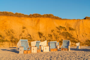 Beach chairs in front of the Red Cliff near Kampen, Sylt Island, Schleswig-Holstein, Germany
