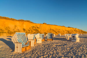 Beach chairs in front of the Red Cliff near Kampen, Sylt Island, Schleswig-Holstein, Germany