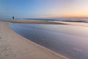 Lonely walker on the beach of Kampen, island Sylt, Schleswig-Holstein, Germany