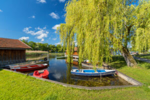 Boat cabins and boats at Staffelsee near Seehausen, Upper Bavaria, Bavaria, Germany