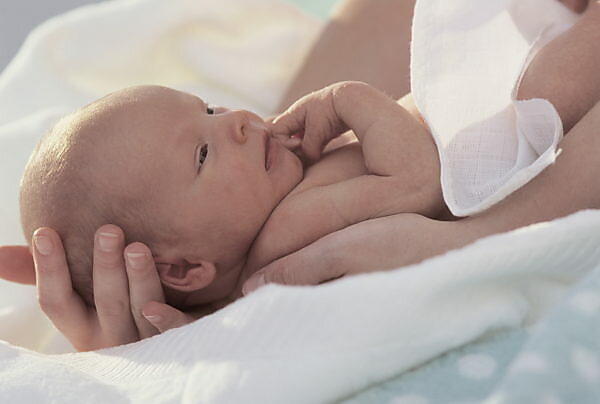 Bildagentur Mauritius Images Baby In The Nude Lie Foot Toes Mouth At The Side Child Back Position Motion Movably Mobility Self Awareness Childhood Discovery Discovery Phase Development Phase Play Perceive Perception