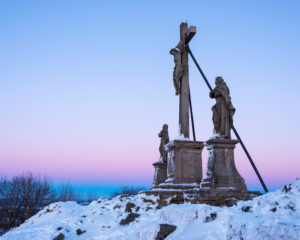 Cross with holy figures at dusk in winter, Milseburg, Danzwiesen, Rhoen Mountain, Hesse, Germany Cross with holy figures at dusk in winter, Milseburg, Danzwiesen, Rhoen Mountain, Hesse, Germany