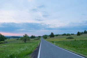 Road, sunrise, spring, Oberelsbach, Lange Rhön, Rhön, Bavaria, Germany Road, sunrise, spring, Oberelsbach, Lange Rhön, Rhön, Bavaria, Germany