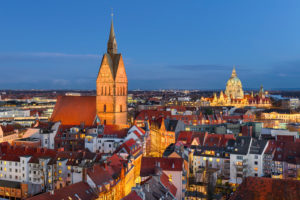 Old city of Hannover, Germany at night with Marktkirche in the foreground and City Hall in the background Old city of Hannover, Germany at night with Marktkirche in the foreground and City Hall in the background