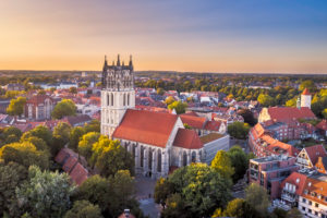 Aerial sunset view of the Überwasserkirche church in Münster, Germany Aerial sunset view of the Überwasserkirche church in Münster, Germany