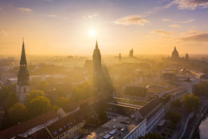 Old town of Hannover, Germany on a foggy autumn morning with Kreuzkirche and Marktkirche churches and Rathaus (Town Hall) in the background Old town of Hannover, Germany on a foggy autumn morning with Kreuzkirche and Marktkirche churches and Rathaus (Town Hall) in the background