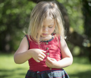 Child playing with daisies Child playing with daisies
