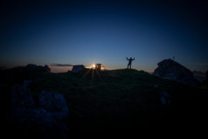 Mountaineer with tent on summit, at sunrise, Hoher Burgstall Mountain, Stubai Alps, Tirol, Austria Mountaineer with tent on summit, at sunrise, Hoher Burgstall Mountain, Stubai Alps, Tirol, Austria