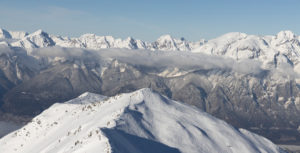 Wintery Tyrolean mountains with a popular touring destination in the foreground. Broken slopes. Country skiing. Wintery Tyrolean mountains with a popular touring destination in the foreground. Broken slopes. Country skiing.