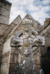 celtic cross in front of Cormac's Chapel, Rock of Cashel, Ireland celtic cross in front of Cormac's Chapel, Rock of Cashel, Ireland