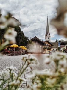 View of the church tower of the old parish church of St. Martin in the old part of Garmisch View of the church tower of the old parish church of St. Martin in the old part of Garmisch
