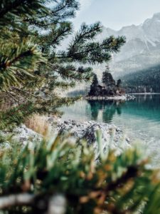 View of a small island with a tiny house on the Eibsee, Garmisch-Partenkirchen, Bavaria View of a small island with a tiny house on the Eibsee, Garmisch-Partenkirchen, Bavaria