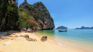 Sandy beach on Phi Phi Island in Thailand, sea, boat Sandy beach on Phi Phi Island in Thailand, sea, boat