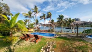 Small pool, beach chairs and hammock on the beach, Fiji Small pool, beach chairs and hammock on the beach, Fiji