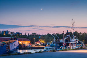 Sweden, Vastmanland, Vasteras, waterfront cafes of the Munkangen harborfront, dusk Sweden, Vastmanland, Vasteras, waterfront cafes of the Munkangen harborfront, dusk