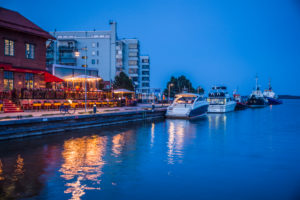 Sweden, Vastmanland, Vasteras, waterfront cafes of the Munkangen harborfront, dusk Sweden, Vastmanland, Vasteras, waterfront cafes of the Munkangen harborfront, dusk