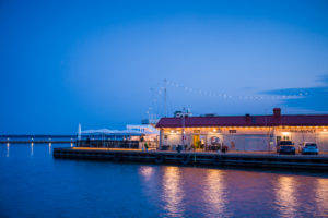 Sweden, Vastmanland, Vasteras, waterfront cafes of the Munkangen harborfront, dusk Sweden, Vastmanland, Vasteras, waterfront cafes of the Munkangen harborfront, dusk