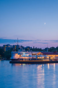 Sweden, Vastmanland, Vasteras, waterfront cafes of the Munkangen harborfront, dusk Sweden, Vastmanland, Vasteras, waterfront cafes of the Munkangen harborfront, dusk