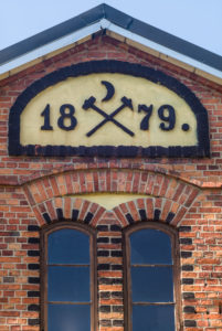 Sweden, Vastmanland, Sala, Sala Silvergruva silver mine, mine buildings with mining symbols, detail Sweden, Vastmanland, Sala, Sala Silvergruva silver mine, mine buildings with mining symbols, detail